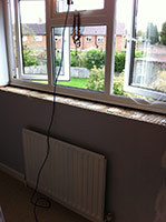 Radiator and window before refurbishment